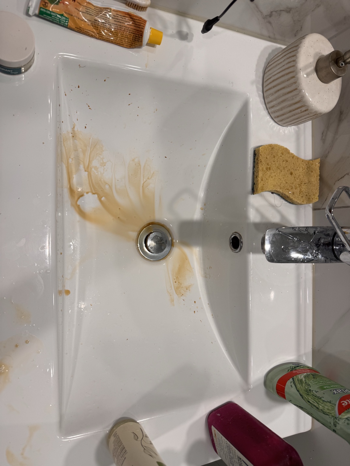 Bathroom basin with spills and residue before cleaning by UrbanShine in Auckland