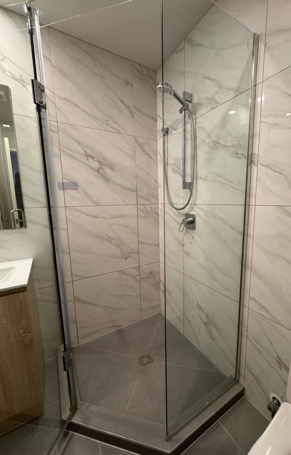 Shower glass, tiles and floor after an UrbanShine cleaning service in Auckland